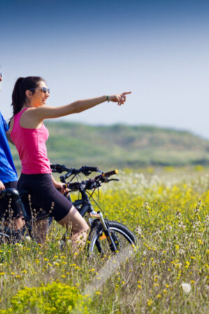 happy-young-couple-bike-ride-countryside